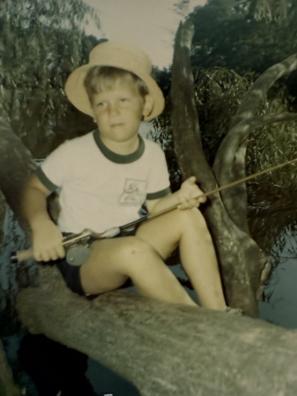 Michael Farr, 6 years old, sits on a weeping willow that used to be on the bank of Lake Gerar. SUBMITTED PHOTO